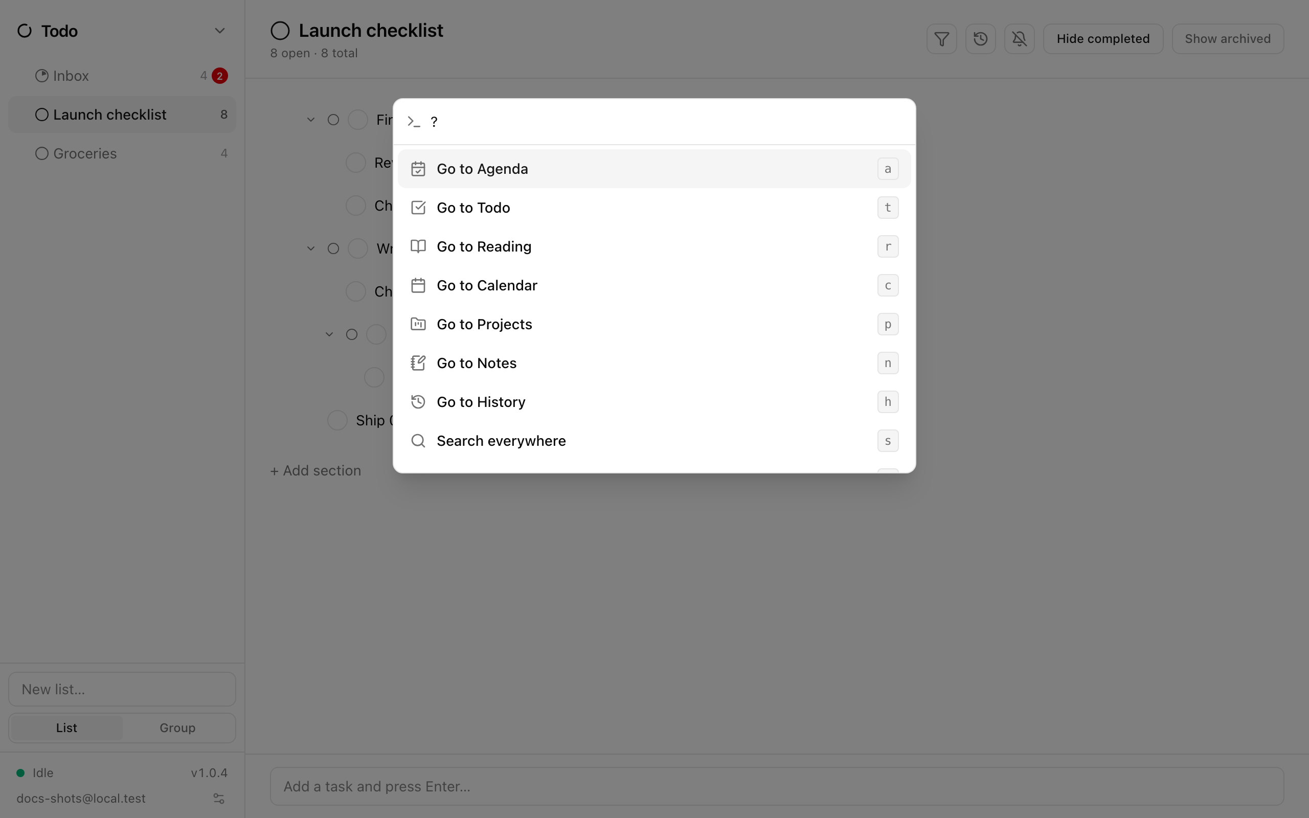 The command palette open over the Todo app, with the ? help list showing every command